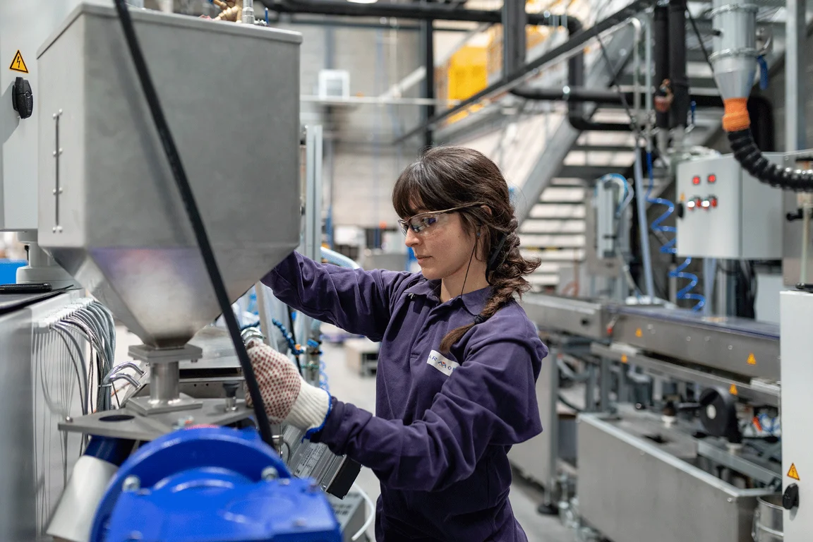 An employee working at an ARMOR Group production facility