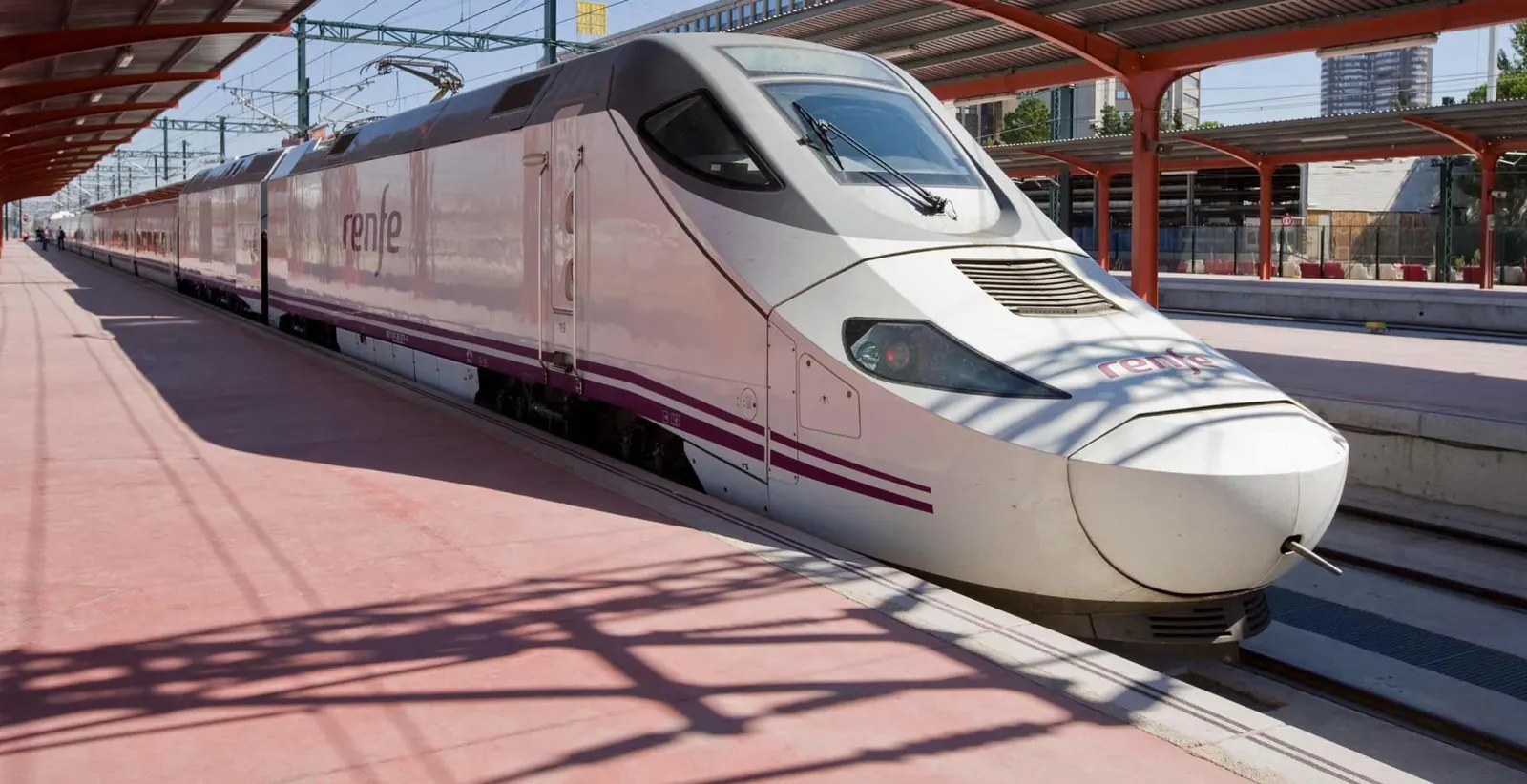 A Renfe high-speed train at a station platform